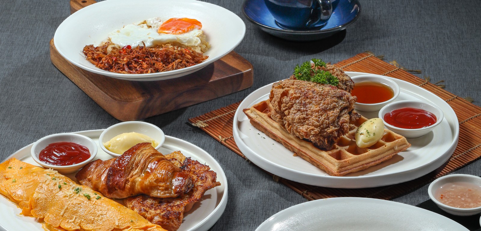 Chicken and waffles brunch spread with coffee